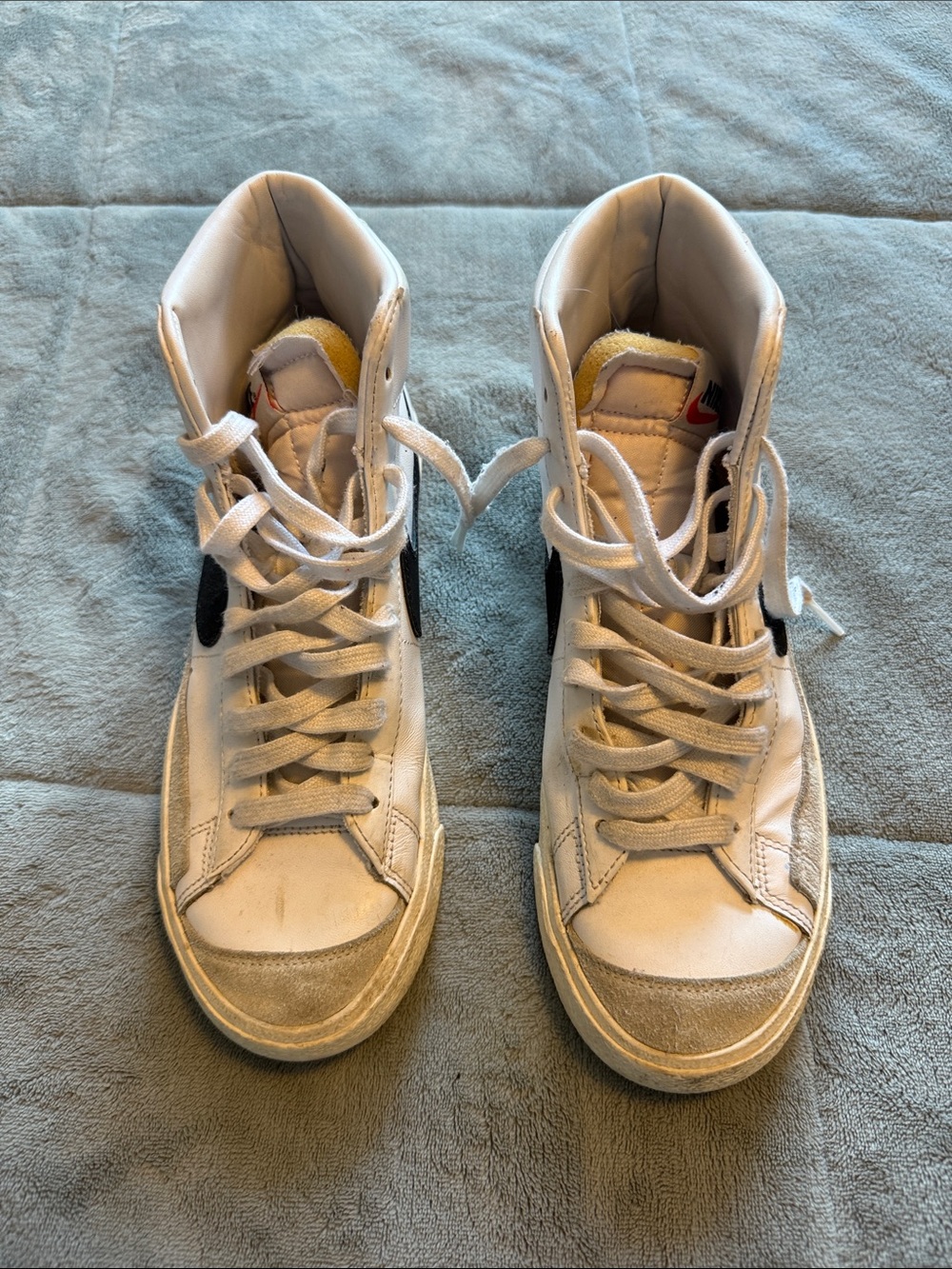 Nike Women’s High-Top Sneakers in White with Black Swoosh